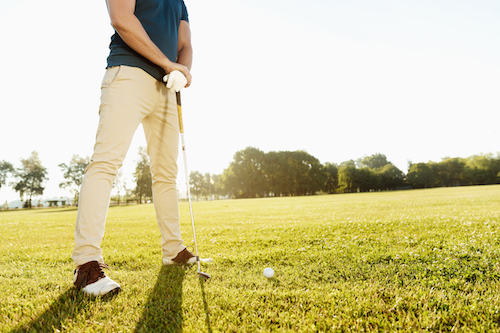 storyblocks-cropped-image-of-a-golfer-getting-ready-to-put-golf-ball-on-green-outdoors_SRWGounpqZ